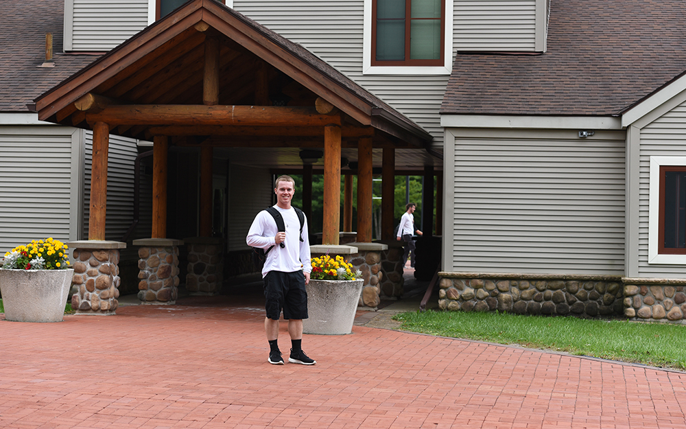 Student outside Adirondack Hall