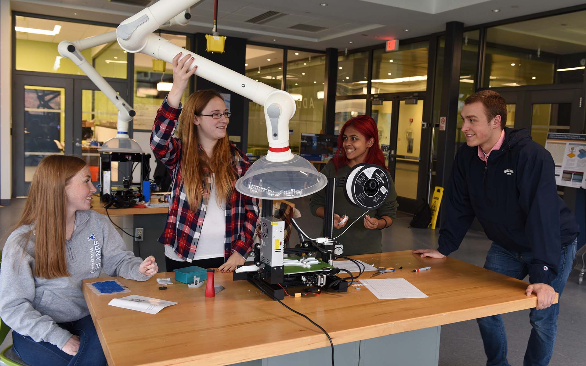 Four SUNY Poly students in the CGAM lab