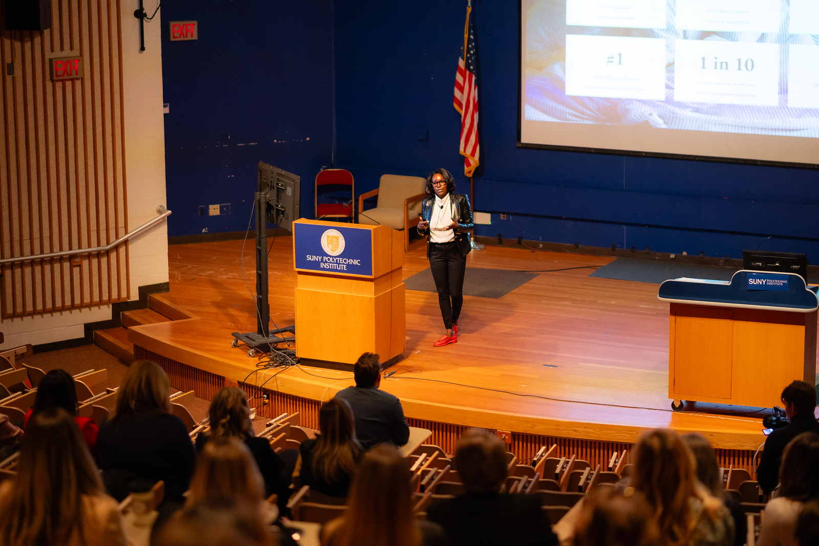 Speaker presenting to an audience during a SUNY Poly event