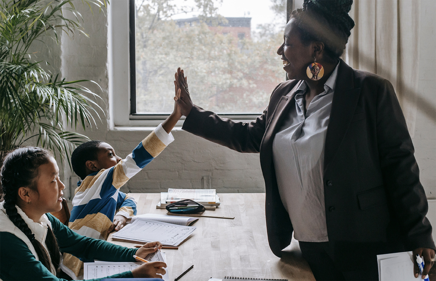 Teacher high five students