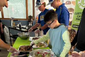 4 boys preparing food