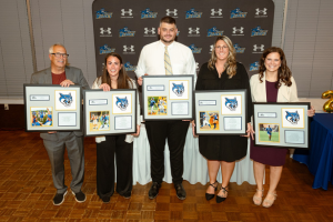 5 people receiving an award