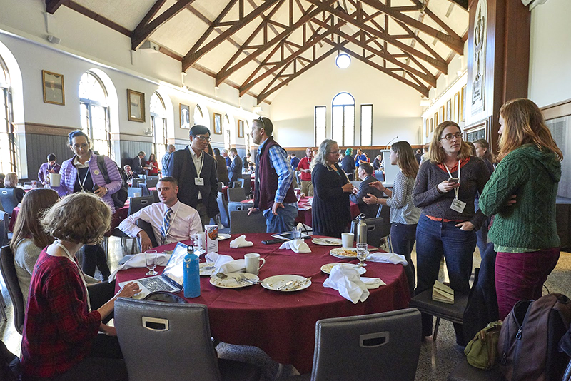 People talking to each other at a conference reception