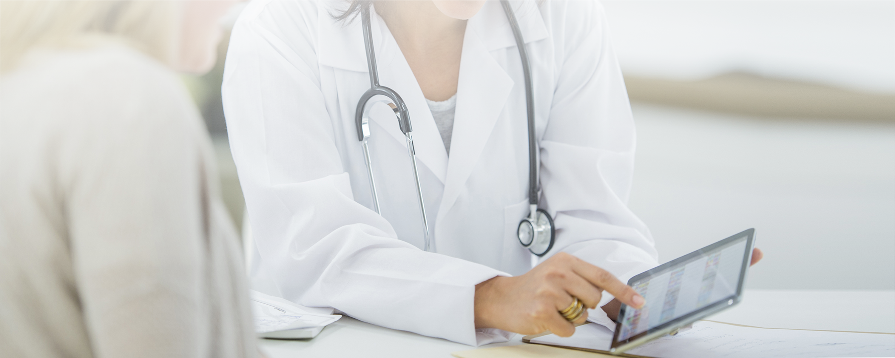 stethoscope with person on tablet