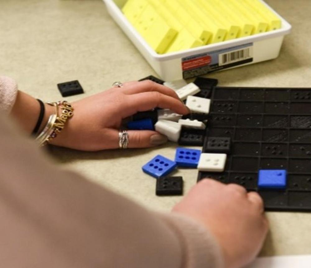 A CABVI employee working with the Braille Blocks