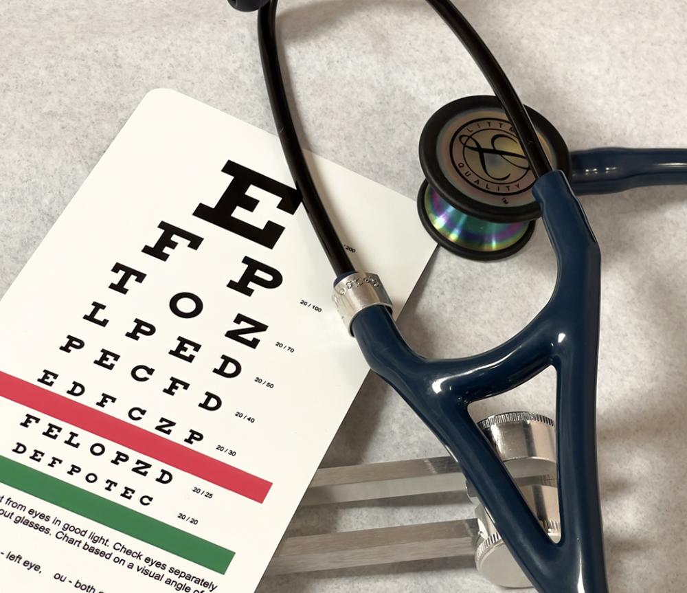 health equipment including vision chart and stethoscope