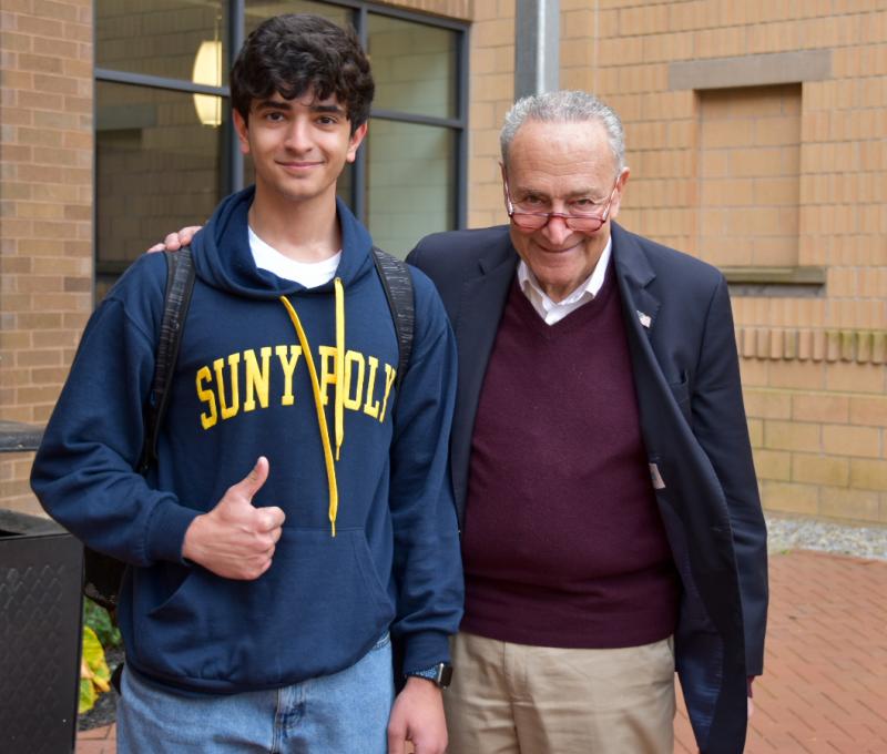 Student Joel Marji with Sen. Charles Schumer outside CGAM 