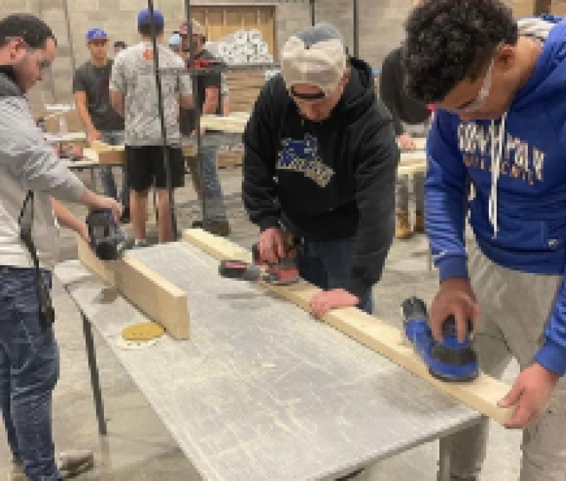 SUNY Poly Students Volunteering by Building Beds