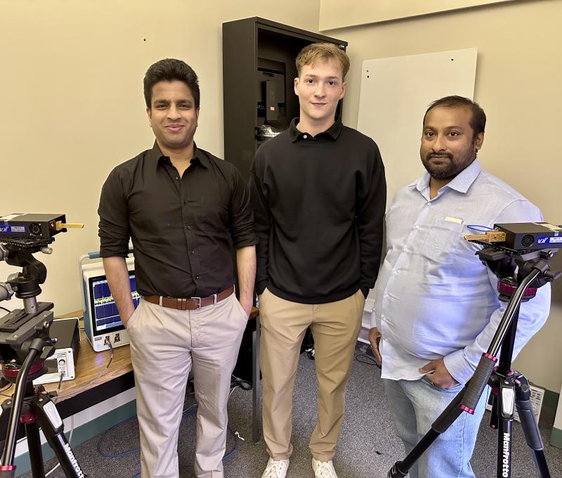 Dr. Singh, Justin Osmond and Dr. Sen in a lab
