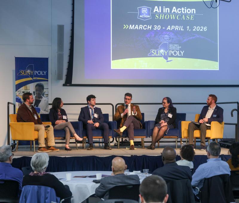 AI panel on workforce featuring six panelists.