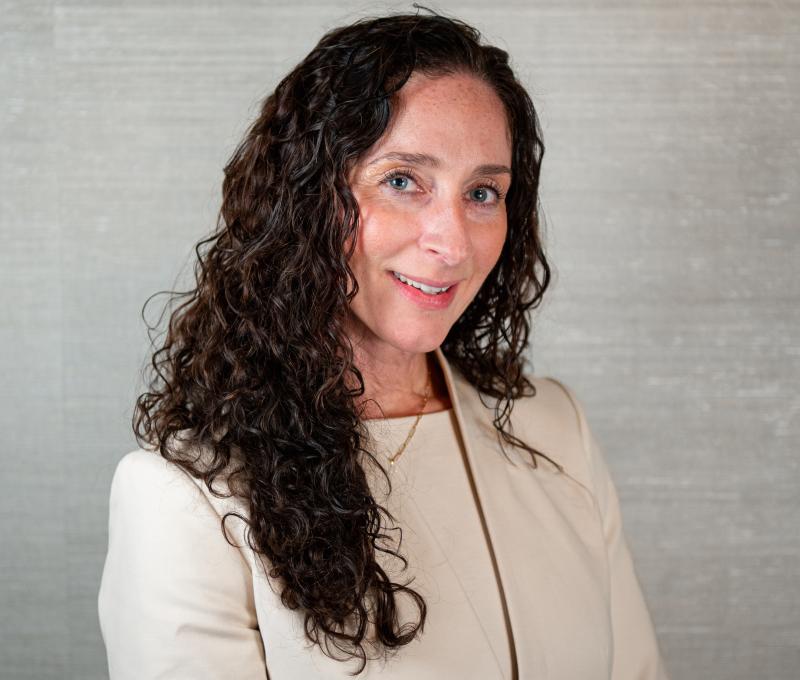 AnneMarie Walker Czyz headshot wearing Beige blazer